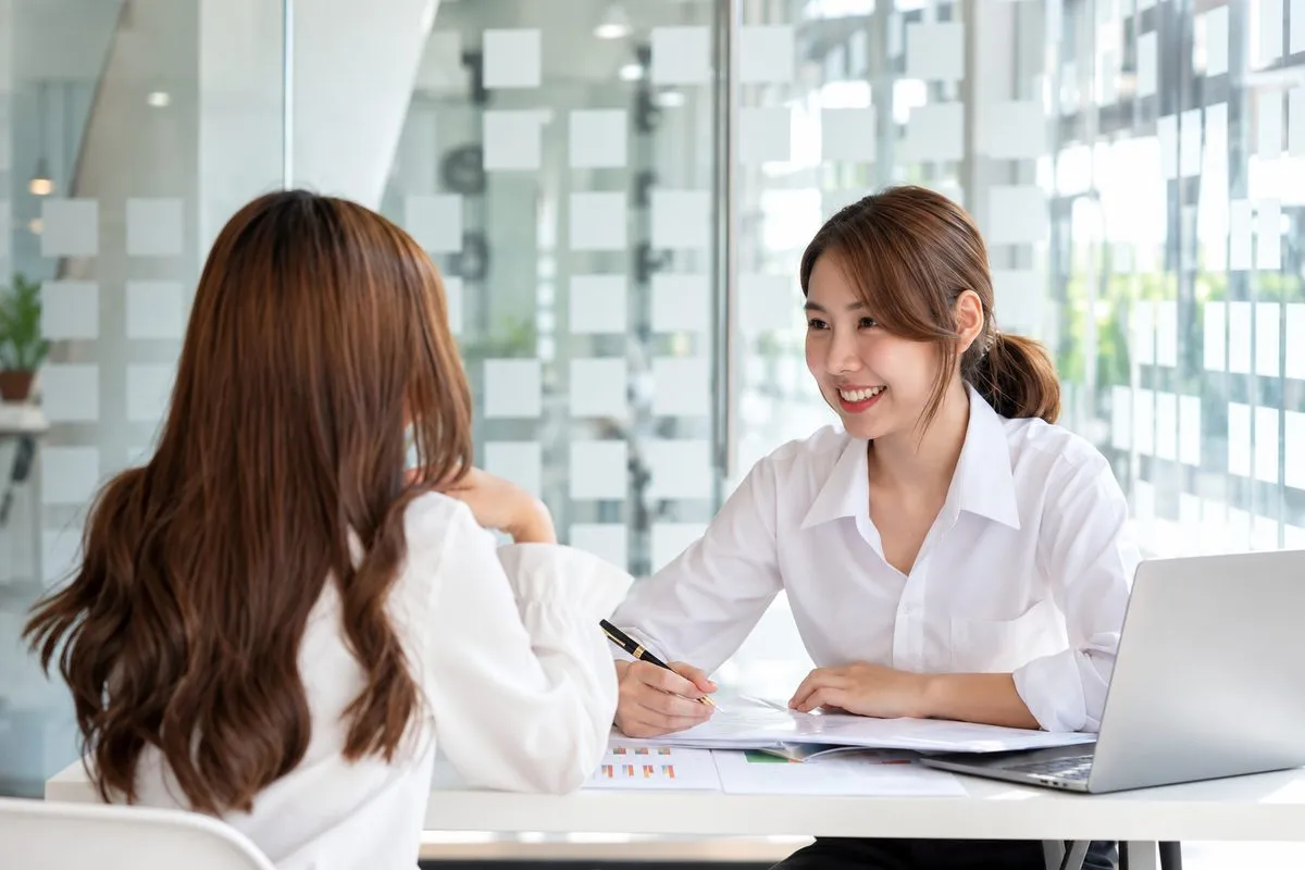 A MIMA consultant discussing website requirements with a client