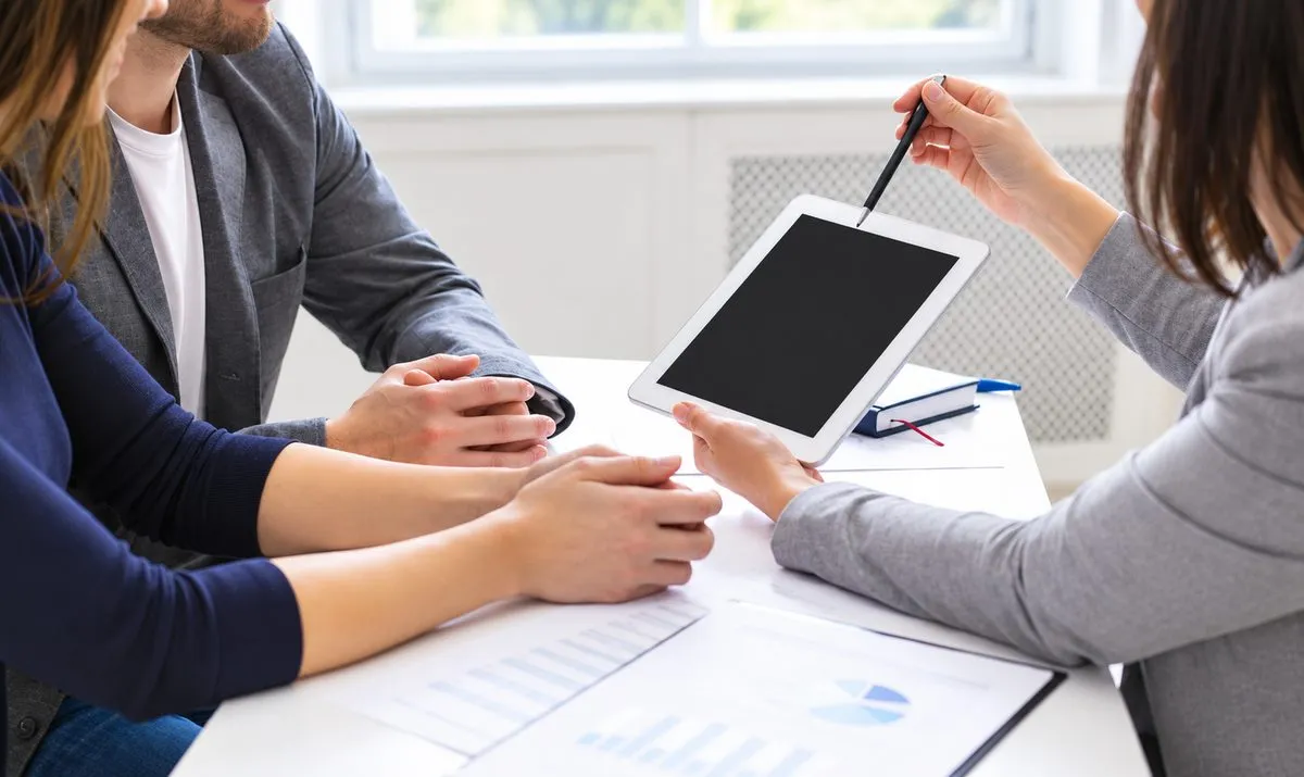 Showing a client how to manage their website on a tablet